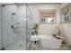 Elegant bathroom featuring a modern shower, a standalone tub, and neutral color tones at 1621 Lakefield Cir, Gastonia, NC 28056