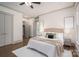 Serene bedroom with hardwood floors, soft lighting, and access to a walk-in closet and bathroom at 1621 Lakefield Cir, Gastonia, NC 28056
