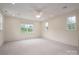 Spacious bonus room featuring neutral carpeting, recessed lighting, large windows and a ceiling fan at 1621 Lakefield Cir, Gastonia, NC 28056
