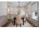 Elegant dining room with chandelier, neutral tones, and stylish furniture at 1621 Lakefield Cir, Gastonia, NC 28056