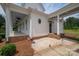 Inviting home exterior boasting a covered porch, white siding, and meticulously landscaped yard at 1621 Lakefield Cir, Gastonia, NC 28056