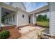Home exterior featuring a covered porch, white siding, and meticulously landscaped yard at 1621 Lakefield Cir, Gastonia, NC 28056
