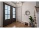 Bright foyer with hardwood floors, a glass paneled door, and modern decor at 1621 Lakefield Cir, Gastonia, NC 28056