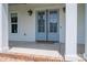 Front door with sidelight, stylish outdoor lighting, and a welcoming doormat at 1621 Lakefield Cir, Gastonia, NC 28056