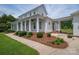 Charming two-story home with a covered porch, manicured landscaping, and a walkway at 1621 Lakefield Cir, Gastonia, NC 28056