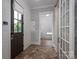 Stylish entry hall featuring a herringbone-patterned floor, and a striking blue and white patterned wallpaper at 1621 Lakefield Cir, Gastonia, NC 28056