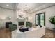 Elegant living room featuring a fireplace, modern lighting, and access to the outdoors at 1621 Lakefield Cir, Gastonia, NC 28056