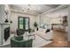 Bright living room with fireplace, modern lighting, and neutral tones offers a cozy and inviting atmosphere at 1621 Lakefield Cir, Gastonia, NC 28056