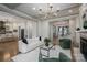 Open-concept living room with seamless flow to the kitchen and a staircase view at 1621 Lakefield Cir, Gastonia, NC 28056