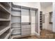 Spacious walk-in closet with custom shelving and ample storage solutions at 1621 Lakefield Cir, Gastonia, NC 28056