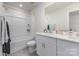 Bathroom offers a shower-tub combo, ample countertop space, and great lighting at 164 Shepherds Landing Dr, Mooresville, NC 28115