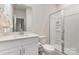 Clean, well-maintained bathroom featuring a glass-enclosed shower and a white vanity at 164 Shepherds Landing Dr, Mooresville, NC 28115