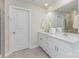 Clean bathroom features a double sink vanity, a large mirror, and neutral finishes at 164 Shepherds Landing Dr, Mooresville, NC 28115