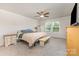 Spacious bedroom features neutral carpet, a ceiling fan, and natural light from two windows at 164 Shepherds Landing Dr, Mooresville, NC 28115
