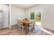 Bright dining area featuring a wooden table and sliding glass door to outdoor area at 164 Shepherds Landing Dr, Mooresville, NC 28115