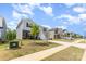 Suburban two-story home showcasing a well-maintained lawn, sidewalk and community street at 164 Shepherds Landing Dr, Mooresville, NC 28115