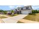 View of a home with a two-car garage and driveway in a suburban community at 164 Shepherds Landing Dr, Mooresville, NC 28115