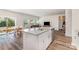 Bright, open kitchen featuring granite countertops, stainless steel appliances, and hardwood style flooring at 164 Shepherds Landing Dr, Mooresville, NC 28115