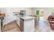 Well-lit modern kitchen boasting granite countertops, stainless steel appliances, and hardwood style flooring at 164 Shepherds Landing Dr, Mooresville, NC 28115