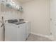 This laundry room features modern appliances and ample shelving for storage solutions at 164 Shepherds Landing Dr, Mooresville, NC 28115