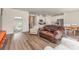 Open-concept living area and kitchen with stainless steel appliances and hardwood flooring at 164 Shepherds Landing Dr, Mooresville, NC 28115