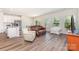 Spacious living area with wood floors, natural light, and view of the dining area at 164 Shepherds Landing Dr, Mooresville, NC 28115