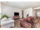 Open-concept space featuring living area with wood floors and natural light at 164 Shepherds Landing Dr, Mooresville, NC 28115