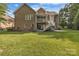 A wide backyard with a lawn plus an elevated screened in porch and deck at 1747 30Th Avenue Ne Dr, Hickory, NC 28601