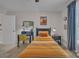 Cozy bedroom features a single bed, blue desk, and an accent chair at 1747 30Th Avenue Ne Dr, Hickory, NC 28601