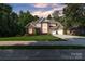 Stunning brick home boasts a manicured lawn and lush landscaping, with an attached two-car garage at 1747 30Th Avenue Ne Dr, Hickory, NC 28601