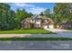 Charming two-story brick home with a well-kept lawn and mature trees, providing curb appeal at 1747 30Th Avenue Ne Dr, Hickory, NC 28601