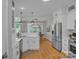 Efficient kitchen with a stainless steel refrigerator, gas range, and white cabinets and counter tops at 1747 30Th Avenue Ne Dr, Hickory, NC 28601