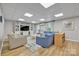 Basement living room with hardwood floors, stylish seating, and custom built-ins at 1747 30Th Avenue Ne Dr, Hickory, NC 28601