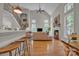 Spacious living room featuring a cozy fireplace, high ceilings, large windows, and hardwood floors at 1747 30Th Avenue Ne Dr, Hickory, NC 28601