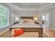 This spacious main bedroom features a view into the bathroom, carpet, and stylish decor at 1747 30Th Avenue Ne Dr, Hickory, NC 28601