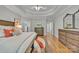 Spacious main bedroom with hardwood floors, neutral walls, and a view into other rooms of the home at 1747 30Th Avenue Ne Dr, Hickory, NC 28601
