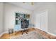 Bright home office with hardwood floors, neutral walls, and a stylish blue desk with shelving at 1747 30Th Avenue Ne Dr, Hickory, NC 28601