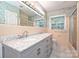 Bathroom featuring double sinks, marble countertops, tiled floors and plenty of lighting at 1961 Runnymede Ln, Charlotte, NC 28211