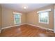 Inviting bedroom with hardwood floors, plenty of light, and neutral paint scheme at 1961 Runnymede Ln, Charlotte, NC 28211