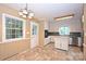 Eat-in kitchen featuring an island, stainless steel dishwasher, and access to the backyard at 1961 Runnymede Ln, Charlotte, NC 28211