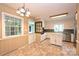 Eat-in kitchen featuring an island and access to the backyard and main room at 1961 Runnymede Ln, Charlotte, NC 28211