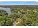 Stunning aerial view of a lakefront property surrounded by mature trees and tranquil waters at 2010 Dogwood Trl, Shelby, NC 28150