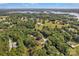 Expansive aerial view of a wooded community with waterfront homes and lake access on a sunny day at 2010 Dogwood Trl, Shelby, NC 28150