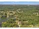 Stunning aerial view of a lakeside community with lush green trees and a serene lake at 2010 Dogwood Trl, Shelby, NC 28150