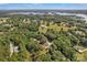 An expansive aerial view shows a lakefront community surrounded by lush greenery at 2010 Dogwood Trl, Shelby, NC 28150