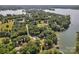 Picturesque aerial view of a lake community, showcasing homes nestled among mature trees and serene waters at 2010 Dogwood Trl, Shelby, NC 28150
