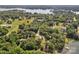 Breathtaking aerial view of a lakefront property surrounded by lush greenery, offering a tranquil setting at 2010 Dogwood Trl, Shelby, NC 28150