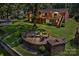Backyard patio with a custom fire pit, seating, and a spacious deck on a two-story home at 2010 Dogwood Trl, Shelby, NC 28150