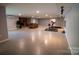 Spacious finished basement with a brick fireplace, a lounge area, and workout equipment at 2010 Dogwood Trl, Shelby, NC 28150