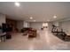 Finished basement featuring a brick fireplace, seating, and workout equipment at 2010 Dogwood Trl, Shelby, NC 28150